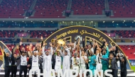 Shabab Al Ahli players and officials celebrate after winning the Challenge Shield yesterday.