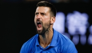 Serbia's Novak Djokovic reacts after a point against Czech Republic's Tomas Machac during their men's singles match on day six of the Australian Open tennis tournament in Melbourne on January 17, 2025. (Photo by Martin KEEP / AFP) 