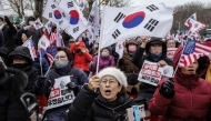 Supporters of impeached South Korean president Yoon Suk Yeol chant slogans during a rally outside the government complex building housing the Corruption Investigation Office for High-ranking Officials (CIO) in Gwacheon on January 16, 2025. Photo by ANTHONY WALLACE / AFP