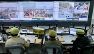 Police monitor the situation via screens at the Integrated Command and Control Center during the Maha Kumbh Mela festival in Prayagraj on January 17, 2025. (Photo by Niharika Kulkarni / AFP) 