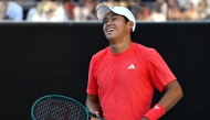 USA's Learner Tien celebrates victory against France's Corentin Moutet during their men's singles match on day seven of the Australian Open tennis tournament in Melbourne on January 18, 2025. (Photo by Paul Crock / AFP)