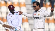 Pakistan's Noman Ali celebrates after taking the wicket of West Indies' Kevin Sinclair (L) during the second day of the first Test cricket match between Pakistan and West Indies at the Multan Cricket Stadium in Multan on January 18, 2025. (Photo by Aamir QURESHI / AFP)