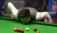 File photo: China's Ding Junhui contemplates a shot during the World Championship Snooker semi-final match against England's Mark Selby at The Crucible in Sheffield, England on April 28, 2017. AFP / PAUL ELLIS

