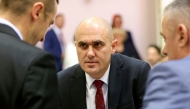 This photograph taken on May 15, 2024, shows then Croatian Minister of Agriculture, Forestry and Fisheries Josip Dabro (C) as he speaks with officials during a meeting in Zagreb. (Photo by DAMIR SENCAR / AFP)
