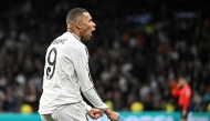 Real Madrid's French forward #09 Kylian Mbappe celebrates scoring his team's first goal during the Spanish Copa del Rey (King's Cup) last 16 first leg football match between Real Madrid CF and RC Celta de Vigo at the Santiago Bernabeu stadium in Madrid on January 16, 2025. (Photo by JAVIER SORIANO / AFP)
