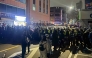 Police stand guard on a street near the Seoul Western District Court in Seoul, early on January 19, 2025, after hundreds of pro-Yoon protesters smashed windows and broke down doors to enter the court following the extension of the detention of impeached South Korea President Yoon Suk Yeol. Photo by Jin-kyu Kang / AFP