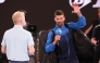 Serbia's Novak Djokovic (R) speaks into the microphone on court after winning his men's singles match against Czech Republic's Jiri Lehecka in Melbourne on January 19, 2025. (Photo by David Gray / AFP)