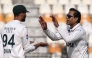 Pakistan's Noman Ali (R) celebrates with his captain Shan Masood after taking the wicket of West Indies' Kevin Sinclair during the second day of the first Test cricket match between Pakistan and West Indies at the Multan Cricket Stadium in Multan on January 18, 2025. (Photo by Aamir QURESHI / AFP)
