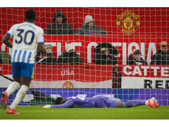 Manchester United's Cameroonian goalkeeper #24 Andre Onana reacts after failing to stop Brighton's third goal scored by Brighton's French midfielder #14 Georginio Rutter during the English Premier League football match between Manchester United and Brighton and Hove Albion at Old Trafford in Manchester, north west England, on January 19, 2025. (Photo by Ian HODGSON / AFP)