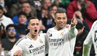 Real Madrid's French forward #09 Kylian Mbappe celebrates scoring his team's third goal with Real Madrid's Spanish defender #17 Lucas Vazquez during Spanish league football match between Real Madrid CF and UD Las Palmas at the Santiago Bernabeu stadium in Madrid on January 19, 2025. (Photo by JAVIER SORIANO / AFP)
