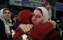 A Palestinian woman cries as she embraces a loved one who was released from Israeli jail in the early hours of January 20, 2025. (Photo by Zain Jaafar / AFP)