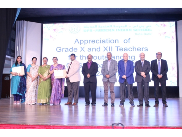 DPS Modern Indian School officials among others while receiving the certification.