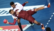 Qatar’s Moustafa Heiba prepares to shoot at the goal during the match against Kuwait.