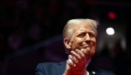 US President-elect Donald Trump reacts during a MAGA victory rally at Capital One Arena in Washington, DC, on January 19, 2025, one day ahead of his inauguration ceremony. (Photo by Jim Watson / AFP)