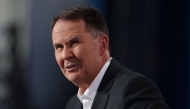 Australian TV sports presenter and journalist Tony Jones is seen on day nine of the Australian Open tennis tournament in Melbourne on January 20, 2025. (Photo by Martin Keep / AFP)