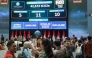 People watch carbon trading activity on a digital screen at the Indonesian stock exchange building in Jakarta on January 20, 2025. (Photo by Bay Ismoyo / AFP)