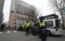 Policemen stand guard in front of the main gate at the Seoul Western District Court in Seoul on January 20, 2025, after supporters of South Korean President Yoon Suk Yeol stormed the building on January 19. (Photo by Jung Yeon-je / AFP)