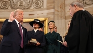 US President-elect Donald Trump takes the oath of office from US Supreme Court Chief Justice John Roberts during inauguration ceremonies in the Rotunda of the US Capitol on January 20, 2025 in Washington, DC. (Photo by Chip Somodevilla/Getty Images/AFP)