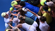 Italy’s Jannik Sinner signs autographs to fans following his victory over Denmark’s Holger Rune.