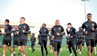 Al Gharafa players during a training session on the eve of the match.