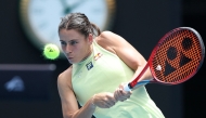 USA's Emma Navarro hits a return to Poland's Iga Swiatek during their women's singles quarter-final match on day eleven of the Australian Open tennis tournament in Melbourne on January 22, 2025. (Photo by Martin Keep / AFP) 