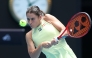 USA's Emma Navarro hits a return to Poland's Iga Swiatek during their women's singles quarter-final match on day eleven of the Australian Open tennis tournament in Melbourne on January 22, 2025. (Photo by Martin Keep / AFP) 