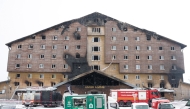 Firefighters and emergency teams work on the aftermath of a fire that broke out in a hotel in the Kartalkaya Ski Resort in Bolu, on January 22, 2025. Photo by Adem ALTAN / AFP