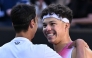 USA's Ben Shelton (R) greets Italy's Lorenzo Sonego (L) after his victory in their men's singles quarter-final match on day eleven of the Australian Open tennis tournament in Melbourne on January 22, 2025. (Photo by William West / AFP) /