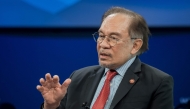 Malaysia's Prime Minister Anwar Ibrahim addresses a speech during the World Economic Forum (WEF) annual meeting in Davos on January 22, 2025. (Photo by FABRICE COFFRINI / AFP)
