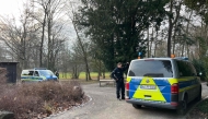 Police cars stand near the site of a stabbing in Aschaffenburg on January 22, 2025. Photo by Pascal HOEFIG / NEWS5 / AFP