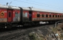 File photo for representation only. A passenger looks out from a carriage of a long-distance train in India. (Punit PARANJPE / AFP)