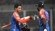 India's Abhishek Sharma (L) is congratulated by Hardik Pandya for his innings during the first Twenty20 international cricket match between India and England at the Eden Gardens in Kolkata on January 22, 2025. (Photo by DIBYANGSHU SARKAR / AFP)