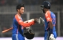 India's Abhishek Sharma (L) is congratulated by Hardik Pandya for his innings during the first Twenty20 international cricket match between India and England at the Eden Gardens in Kolkata on January 22, 2025. (Photo by DIBYANGSHU SARKAR / AFP)