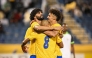 Al Gharafa's Ferjani Sassi (left) celebrates with teammates.