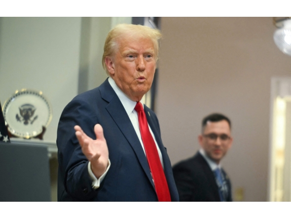 US President Donald Trump gestures as he leaves after speaking at the White House on January 21, 2025, in Washington, DC. (Photo by Jim Watson / AFP)