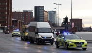 A Prison van escorted by police arrives at The Queen Elizabeth II Law Courts in Liverpool, north west England on January 23, 2025, ahead of the sentencing Southport attacker Axel Rudakubana. (Photo by Darren Staples / AFP)
