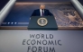 US President Donald Trump is seen on a large screen during his address by video conference at the World Economic Forum (WEF) annual meeting in Davos on January 23, 2025 (Photo by Fabrice Coffrini / AFP)
