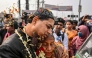 A former member of the Bangladesh Rifles (BDR), who were detained in 2009 over a violent mutiny that massacred dozens of senior army officers, meets with his relative after getting released from the Dhaka Central Jail in Keraniganj on the outskirts of Dhaka on January 23, 2025. (Photo by Munir Uz Zaman / AFP)