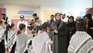 Minister of Education and Higher Education H E Lolwah bint Rashid Al Khater interacting with students during a visit to Audio Education Complex.