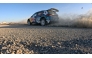 Qatar's Nasser Saleh Al Attiyah and navigator Candido Carrera drive during the 28th Oman International Rally, yesterday.