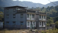 Photo taken on January 18, 2025 shows old village houses in the 300-year-old seaside Kuk Po village at the edge of Hong Kong as scores of visitors descend on the place as the city seeks to diversify its tourism offerings with glimpses of history and lush nature. Photo by Peter PARKS / AFP