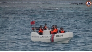 In this handout photo taken on January 24, 2025, China Coast Guard officers check an incident with Philippine Bureau of Fisheries and Aquatic Resources (BFAR) during a marine scientific survey near Thitu Island. (Photo by Handout / Philippine Coast Guard (PCG) / AFP) 