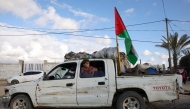 Displaced Palestinians arrive with their belongings northwest of Nuseirat in the central part of the strip on January 24, 2025. (Photo by Bashar Taleb / AFP)