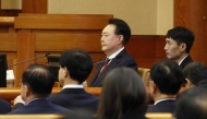 South Korea’s impeached President Yoon Suk Yeol (C) attends the fourth hearing of his impeachment trial over his short-lived imposition of martial law at the Constitutional Court in Seoul on January 23, 2025. (Photo by JEON HEON-KYUN / POOL / AFP)
