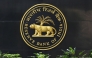 The Reserve Bank of India (RBI) logo is seen at the RBI headquarters in Mumbai on August 10, 2023. (Photo by Indranil Mukherjee / AFP)