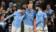 Manchester City's Norwegian striker #09 Erling Haaland celebrates scoring the team's second goal with Manchester City's Egyptian striker #07 Omar Marmoush (L) and Manchester City's Croatian defender #24 Josko Gvardiolduring the English Premier League football match between Manchester City and Chelsea at the Etihad Stadium in Manchester, north west England, on January 25, 2025. (Photo by Oli SCARFF / AFP)