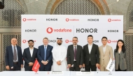 Executives from Vodafone Qatar and Honor at the MoU signing ceremony. 