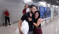 Luis Antonio Rodrigues Santos is welcomed by Eliana Campos after being deported from US arrive at Confins International Airport in Confins, Minas Gerais state, Brazil on January 25, 2025. Photo by Douglas MAGNO / AFP.
