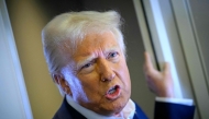 US President Donald Trump speaks with the press on board Air Force One after departing Las Vegas, Nevada, en route to Miami, Florida on January 25, 2025. (Photo by Mandel Ngan / AFP)