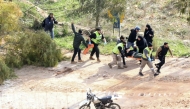 Rescuers in Chaqra carry an injured person shot by Israeli soldiers on January 26, 2025. (Photo by Mahmoud ZAYYAT / AFP)
